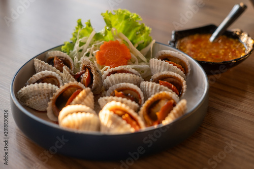 Blood clam served on plate on the table