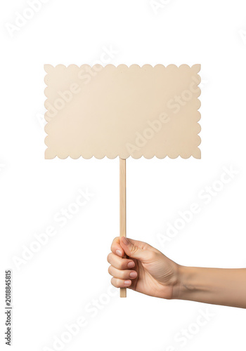 Hand holding a scalloped sign on a wooden stick isolated on transparent background