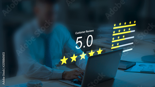 Businessman Managing Online Customer Reviews and Feedback Ratings on Laptop at Night, Digital Reputation Management, Customer Satisfaction Survey, Five Star Review Concept, CRM Technology and User Exp