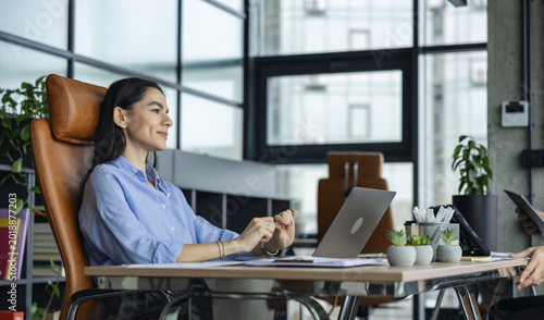 Business success. Businesswoman boss in business office. Woman office manager. Woman CEO or secretary assistant. Businesswoman boss with laptop in office. Thoughtful and inspired