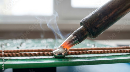 Close-up of A Soldering Iron Melting Solder Onto Copper Wires Creating A Strong Electrical Connection Concept Architecture and Design