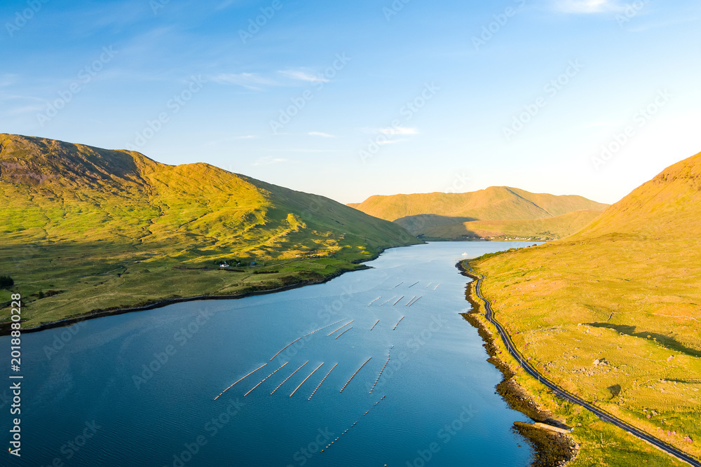 Naklejka premium Aerial view of Killary Fjord near Leenane on the Galway Mayo border, Ireland. Irelands only fjord winds through the dramatic Connemara and Mayo mountain landscape.