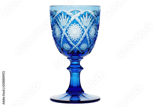 Ornate blue crystal glass goblet with intricate cut patterns isolated on transparent background, decorative glassware for wine or special occasions.