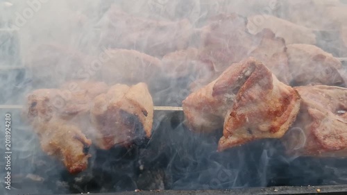 Smoky pork shish kebabs cooking on a barbecue grill