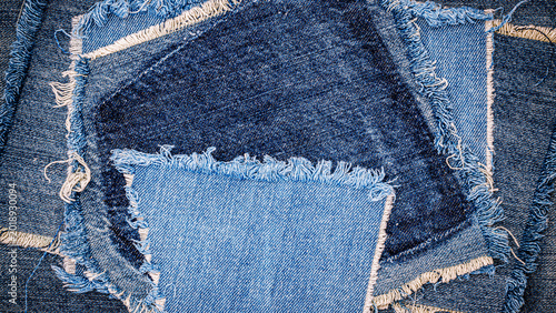 Different pieces of denim fabric arranged in a circular pattern in a textile workspace