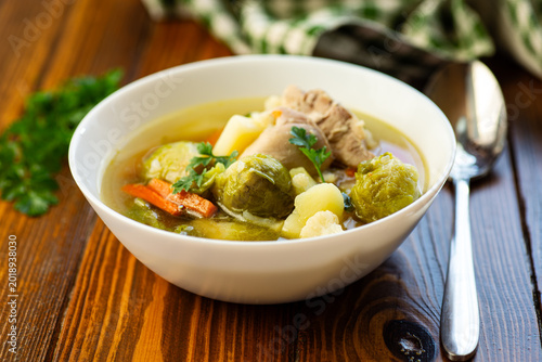 Photos healthy homemade chicken soup with vegetables in white bowl