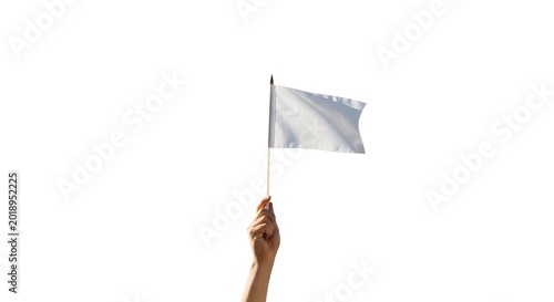 A hand holding a white flag on a stick isolated on white background