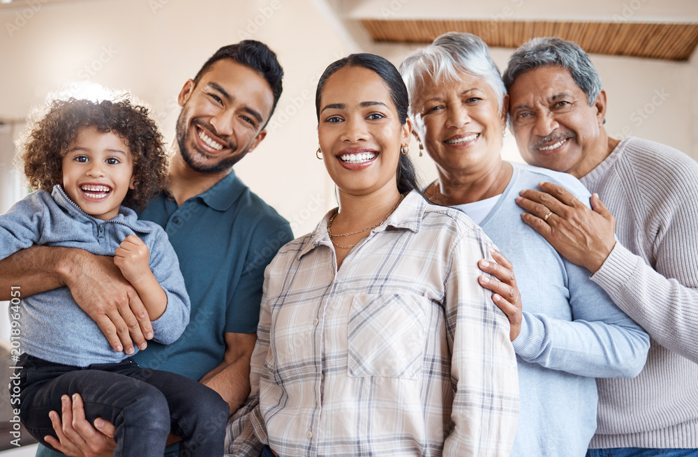 Obraz premium Portrait, generations and parents with child with hug, bonding and love in home living room. Big family, mom and dad with boy and grandparents smile for weekend break, support and comfort with trust