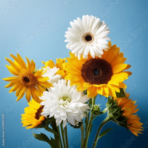 Bright Flowers in a Vase Against a Blue Background During Daylight Hours