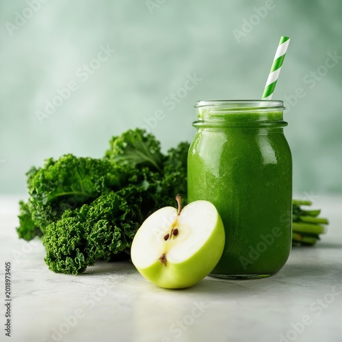 Green Smoothie With Kale and Apple on a Blue Background