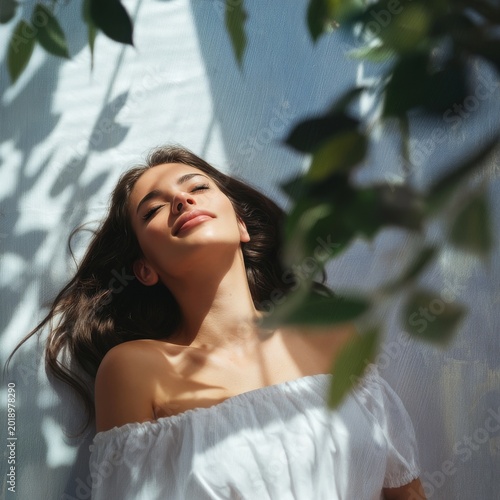 Woman Resting Outdoors on a Sunny Day With Natural Light and Greenery Around Her