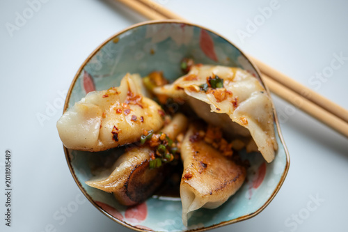High angle shot of handmade Chinese Jiaozi dumplings, gluten-free version, authentic Asian cuisine, Pan-fried