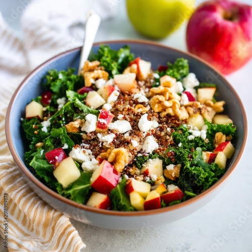 Fresh Salad With Kale, Quinoa, Apple, and Walnuts Served in a Bowl During Day...