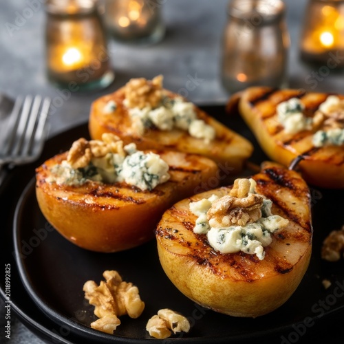 Grilled Pears With Blue Cheese and Walnuts Served on a Black Plate in Soft Ca...