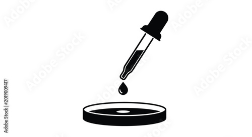 Dropper with liquid drop over petri dish silhouette