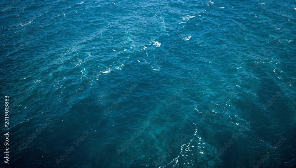 Fototapeta premium Sparkling Blue Sea Water Surface with Gentle Waves and Sun Reflections