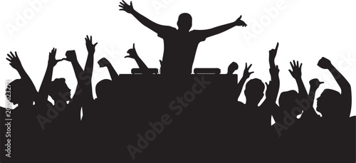 Silhouette of a dj performing at a music festival with a crowd of people raising their hands in the air, creating an energetic party atmosphere