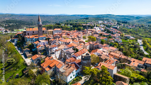 Aerial view of Buje, a charming medieval hilltop town in Istria, Croatia. Its historic architecture and lush surroundings make it a picturesque travel destination.