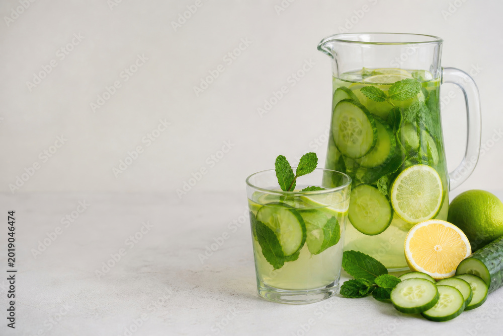 Fototapeta premium Cucumber drink with lemon and mint. Space for text.