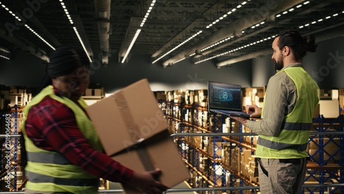 Fotografie Staff member using AI-powered interface with deep learning on laptop, artificial intelligence and neural networks supporting e-commerce operations, order fulfillment for large business