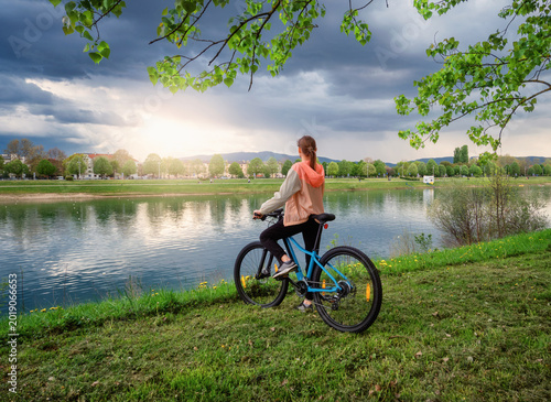 Woman riding a mountain bik...