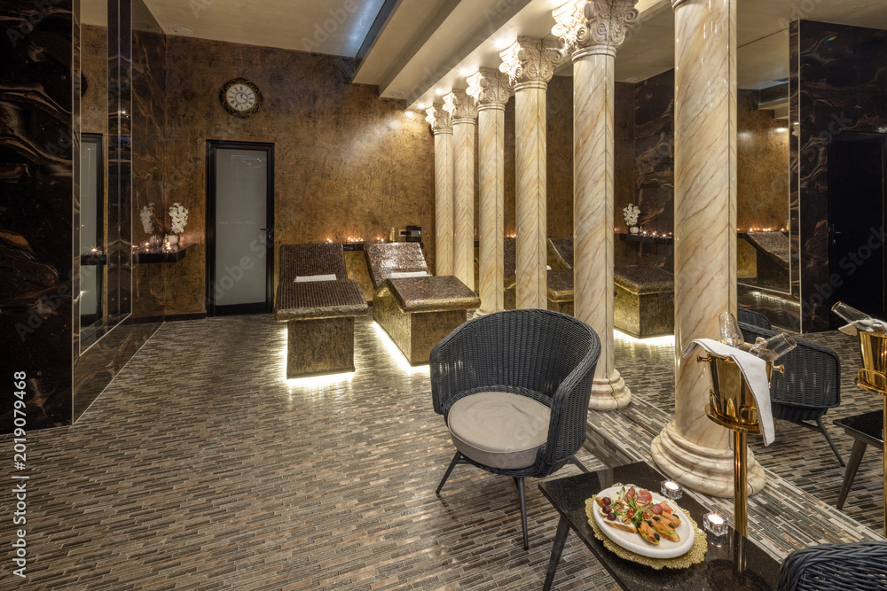 Fototapeta premium Opulent spa wellness center with marble columns and heated relaxation beds