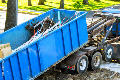 Canvastavla Truck unloads debris at construction site in neighborhood