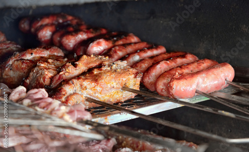 Fotografie Traditional Brazilian barbecue being prepared on a grill