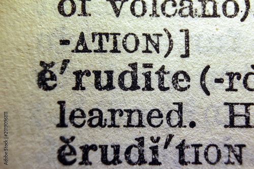 Fotografie Word erudite on dictionary page, macro close up