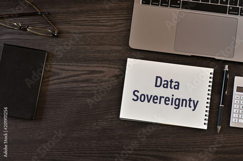 Secure technology and Data Sovereignty on notebook with laptop, calculator. Cyber security, protection and digital trust.