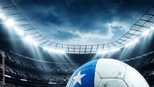 Chilean soccer ball on vibrant green grass, cinematic slow tilt-up revealing a crowded professional stadium with bright floodlights and a dramatic sky, symbolizing national pride and sporting events.