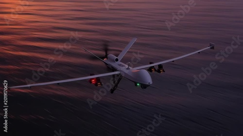 Unmanned drone flying over calm water during sunset with soft pink and purple sky.