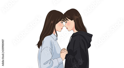 Two young women holding hands with foreheads touching in profile