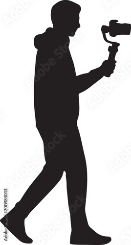 Schilderij op canvas Videographer silhouette walking with camera and gimbal stabilizer