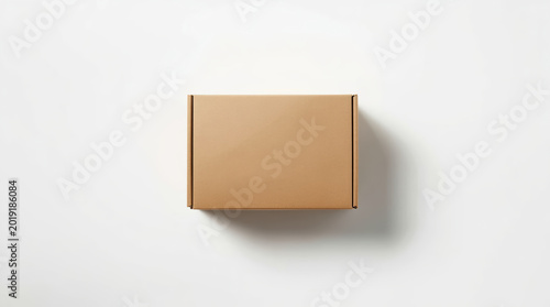 Minimal brown cardboard box mockup on white background with soft shadow and clean lighting