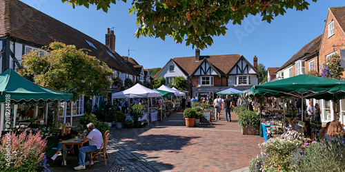 Bustling Farmers Market Square: Daytime Shopping and Leisure in a Colorful, Charming Outdoor Community