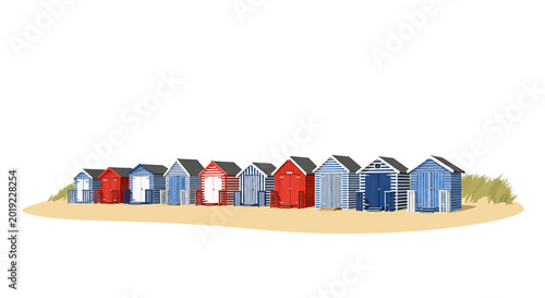 Colorful row of traditional beach huts on sand dunes