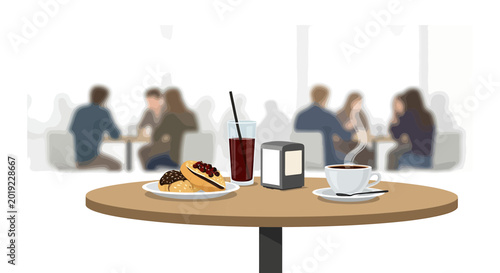 Coffee and pastries on a cafe table with blurred people in background