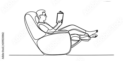 Photos A man sitting comfortably in a modern recliner chair reading a book in a continu