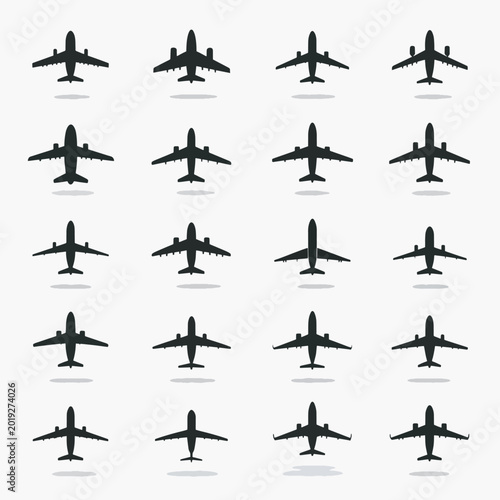Collection of airplane silhouettes flying.