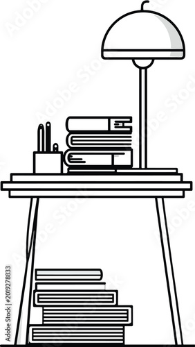 Desk lamp on a table with books.