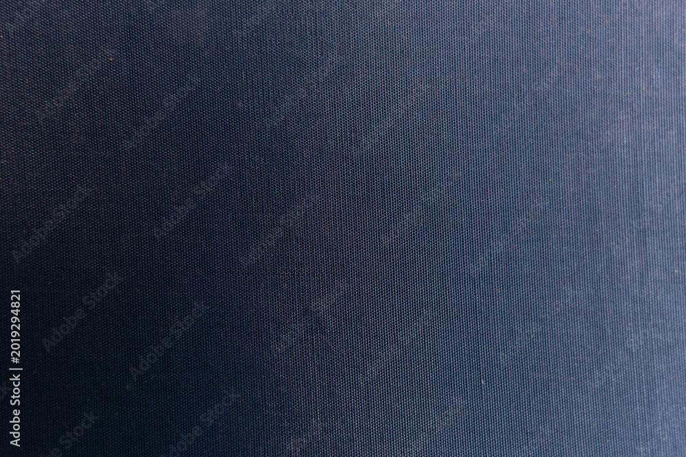 Fototapeta premium Aged Fabric Book Cover Texture with Dark Blue Patina and with subtle lighting gradient