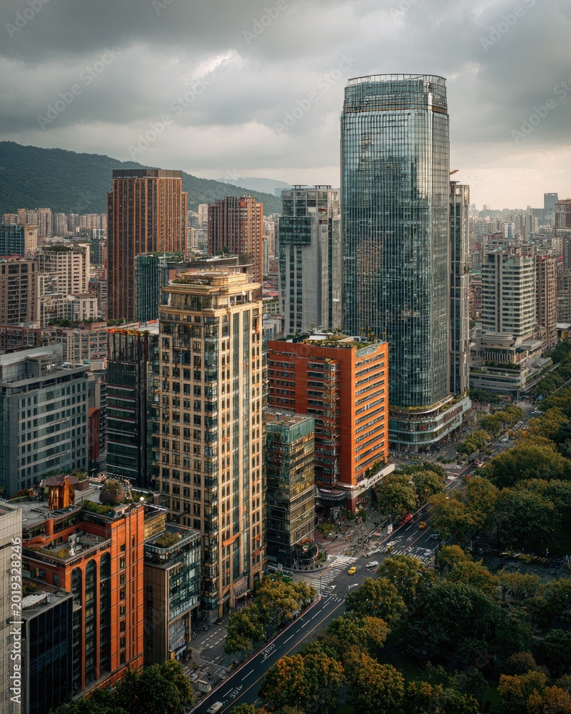Fototapeta premium Urban Cityscape with Modern Skyscrapers and Lush Greenery