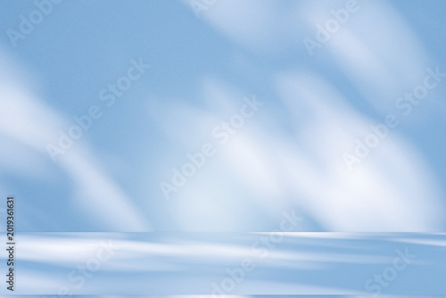 Wall interior background, studio and backdrops show products.with shadow from window color white and blue background for text insertion and presentation product	