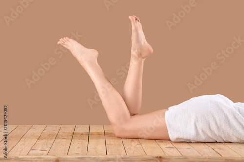 Legs of woman with towel ly...
