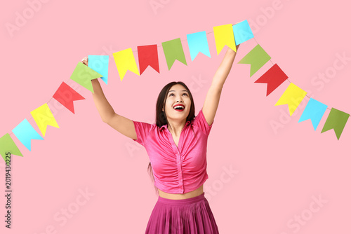 Happy young woman with fest...