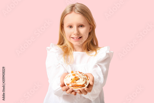 Cute little girl with tasty...