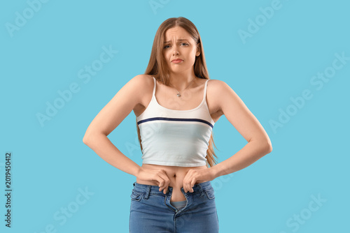 Upset young woman in tight ...