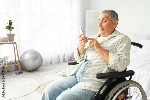 Senior woman in wheelchair ...