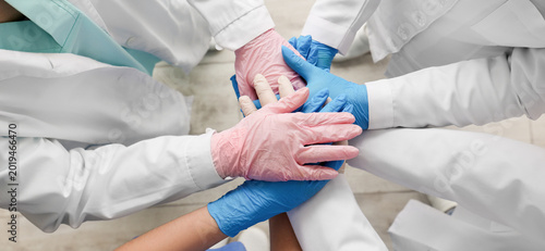 Doctors in medical gloves p...